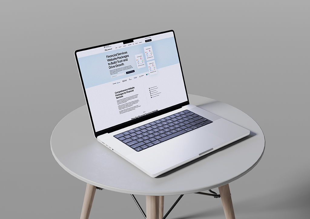 Laptop displaying a financial services website on a round table, showcasing website packages designed to build trust and drive growth for financial professionals.