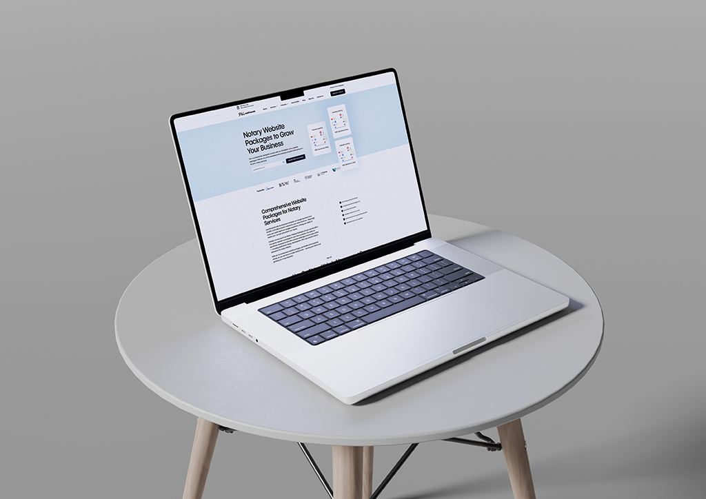 Laptop displaying a website focused on digital marketing services, placed on a minimalist round table with a neutral background. The screen showcases information about comprehensive website packages designed to grow businesses.